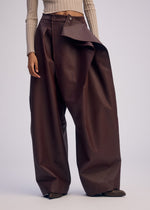 A model wears the ISSEY MIYAKE PRONOUNCED BODY clothing.