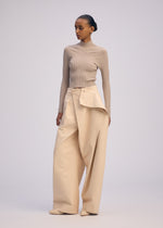 A model wears the ISSEY MIYAKE PRONOUNCED BODY clothing.