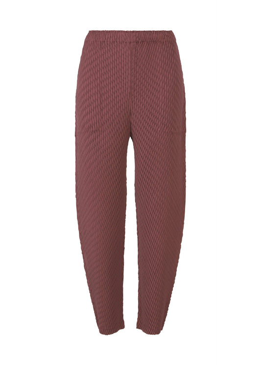 A product shot of the ISSEY MIYAKE SLEEK PLEATS trousers in burgundy.