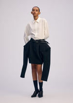 A model wears the ISSEY MIYAKE ARMS clothing.