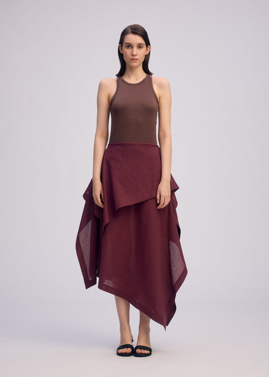 A model wears the ISSEY MIYAKE ALL SQUARES skirt.