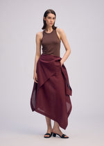 A model wears the ISSEY MIYAKE ALL SQUARES skirt.