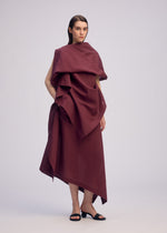 A model wears the ISSEY MIYAKE ALL SQUARES skirt.