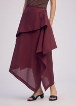 A model wears the ISSEY MIYAKE ALL SQUARES skirt.