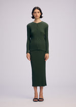 A model wears the ISSEY MIYAKE RHOMBUS PLEATS skirt.