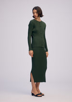 A model wears the ISSEY MIYAKE RHOMBUS PLEATS skirt.