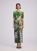 A model wears the ISSEY MIYAKE URBAN JUNGLE PLEATS skirt.