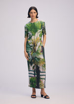 A model wears the ISSEY MIYAKE URBAN JUNGLE PLEATS skirt.