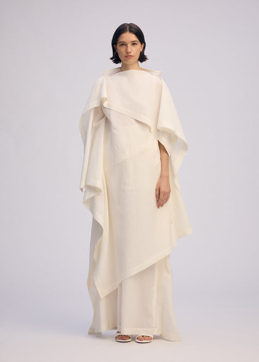 A model wears the ISSEY MIYAKE ALL SQUARES dress.