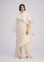 A model wears the ISSEY MIYAKE ALL SQUARES dress.