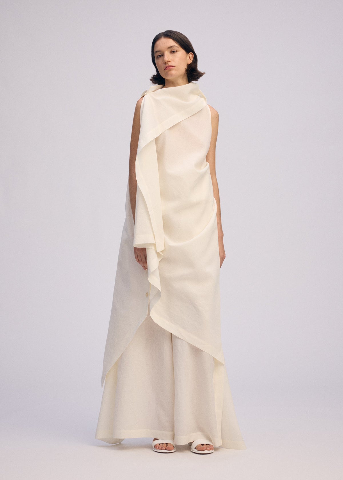 A model wears the ISSEY MIYAKE ALL SQUARES dress.