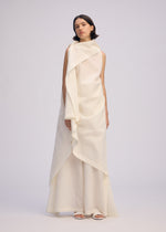 A model wears the ISSEY MIYAKE ALL SQUARES dress.
