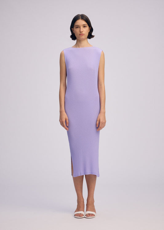 A model wears the ISSEY MIYAKE RHOMBUS PLEATS dress.