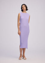 A model wears the ISSEY MIYAKE RHOMBUS PLEATS dress.