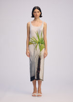 A model wears the ISSEY MIYAKE URBAN JUNGLE PLEATS dress.