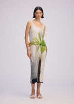A model wears the ISSEY MIYAKE URBAN JUNGLE PLEATS dress.