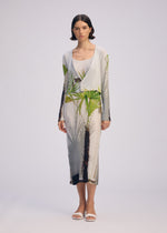 A model wears the ISSEY MIYAKE URBAN JUNGLE PLEATS dress.