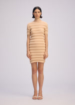 A model wears the ISSEY MIYAKE SPRING PLEATS spring-pleats-dress-black.