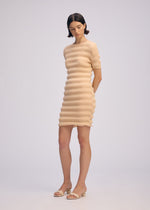 A model wears the ISSEY MIYAKE SPRING PLEATS spring-pleats-dress-black.