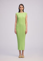 A model wears the ISSEY MIYAKE LINEN LIKE RIB PLEATS dress.