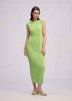 A model wears the ISSEY MIYAKE LINEN LIKE RIB PLEATS dress.
