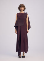 A model wears the ISSEY MIYAKE PLEATED ON PLEATS dress.