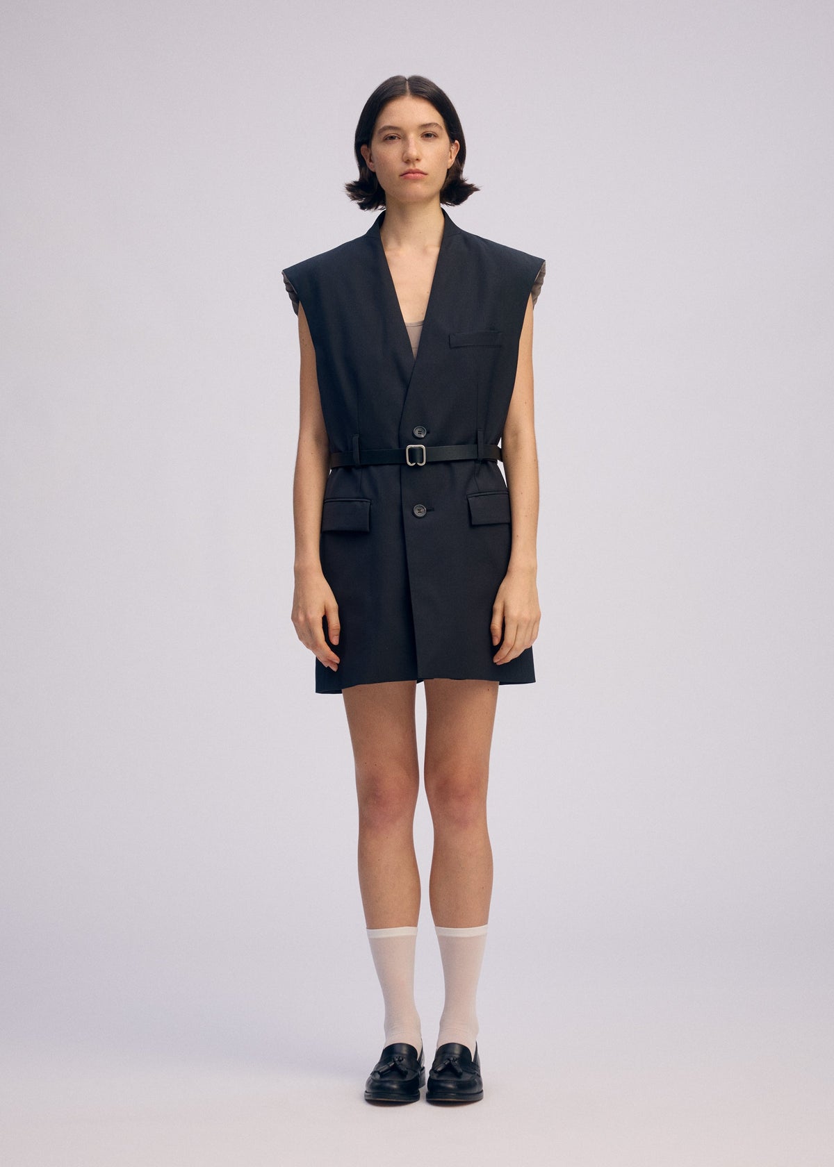 A model wears the ISSEY MIYAKE PALINDROME jumpsuit.