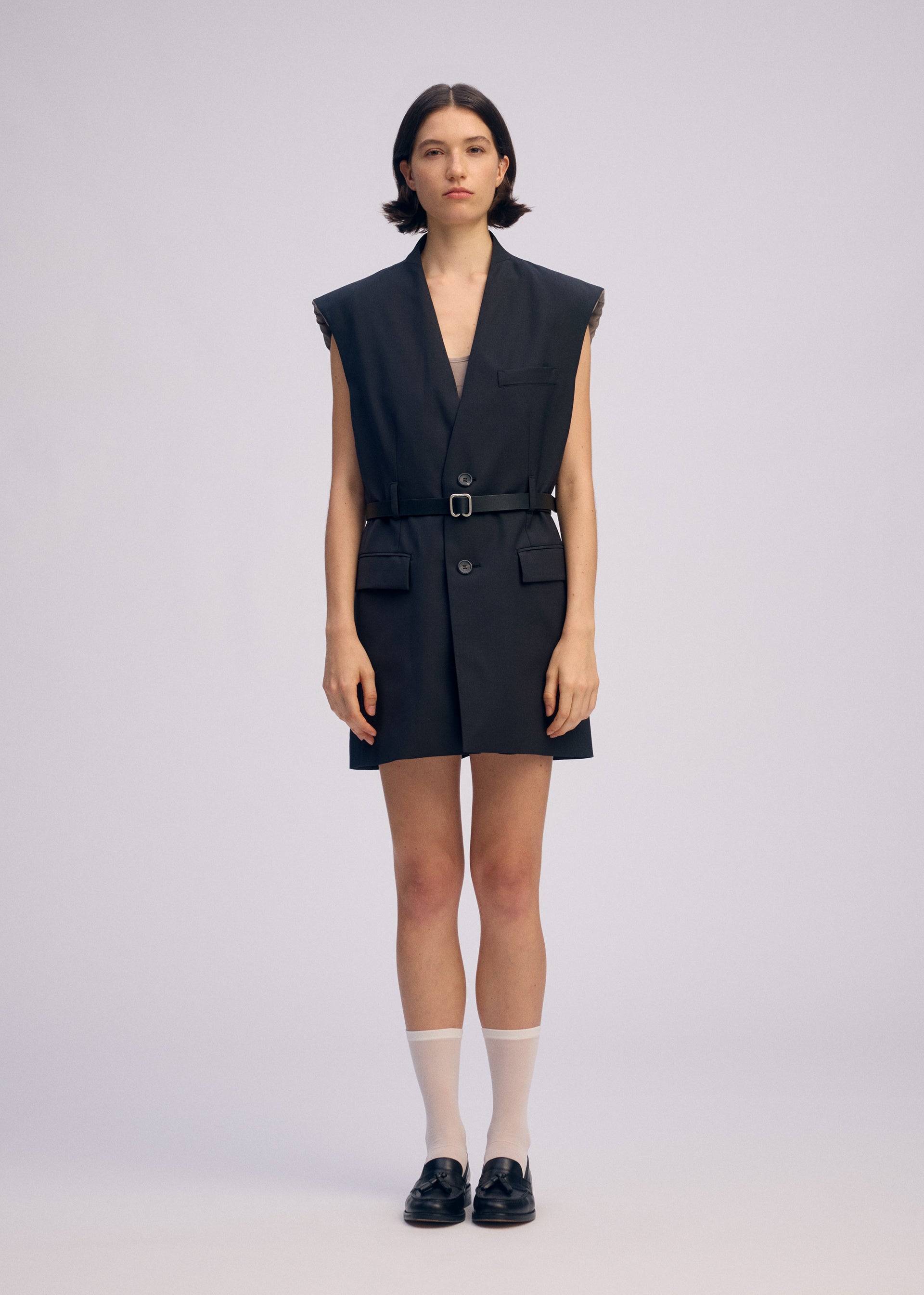 A model wears the ISSEY MIYAKE PALINDROME jumpsuit.