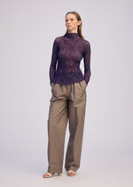 A model wears the ISSEY MIYAKE CHIFFON TWIST 2 shirt.