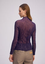 A model wears the ISSEY MIYAKE CHIFFON TWIST 2 shirt.