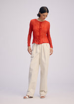 A model wears the ISSEY MIYAKE CHIFFON TWIST 2 shirt.