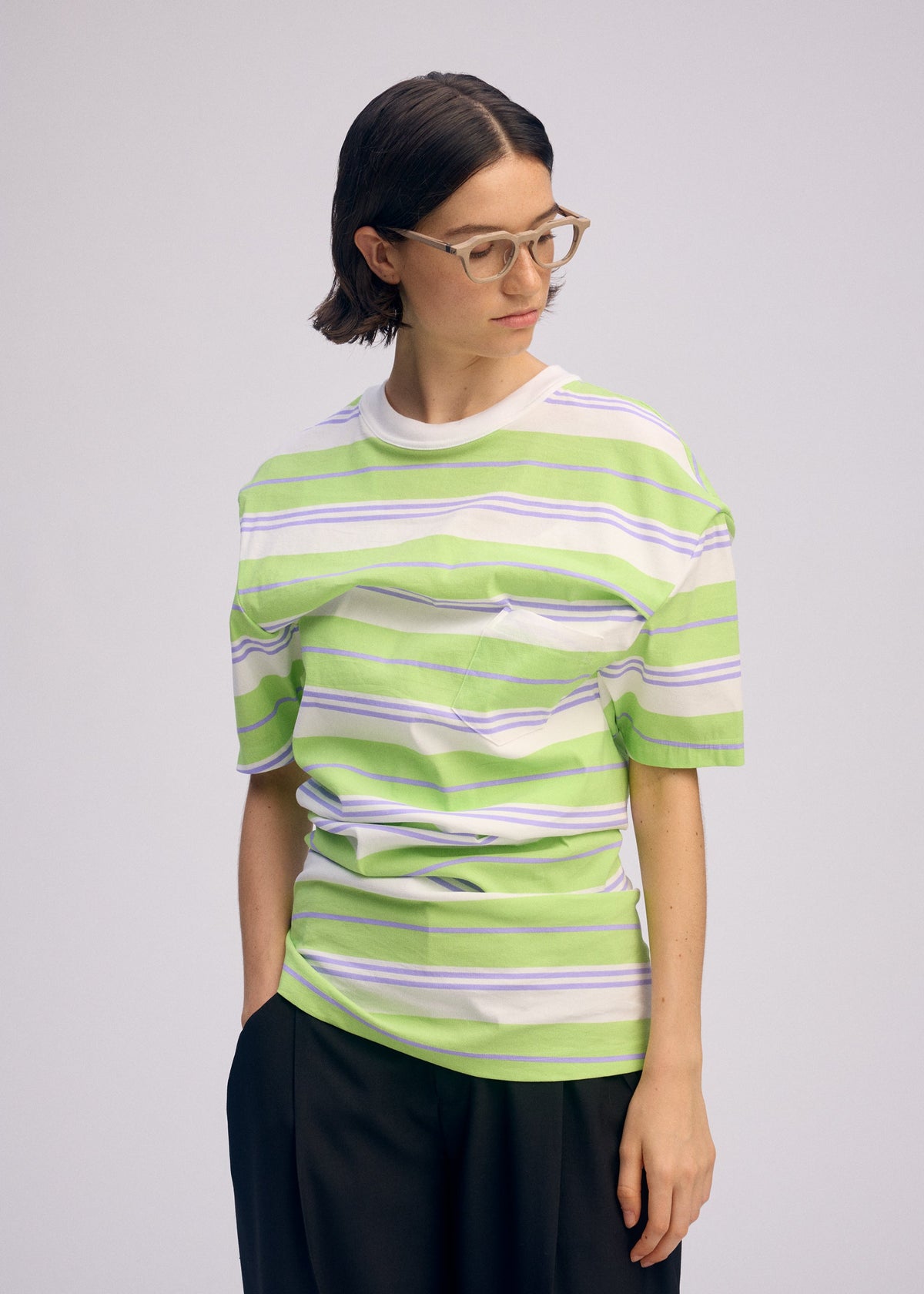 A model wears the ISSEY MIYAKE GENERIC WEAR STRIPES shirt.