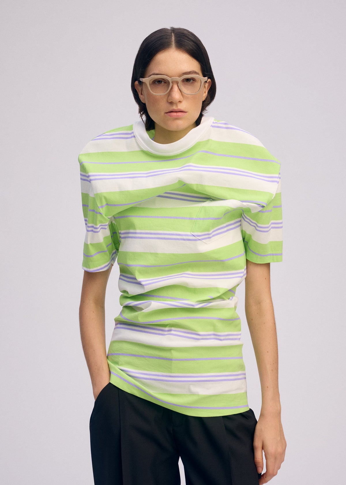 A model wears the ISSEY MIYAKE GENERIC WEAR STRIPES shirt.