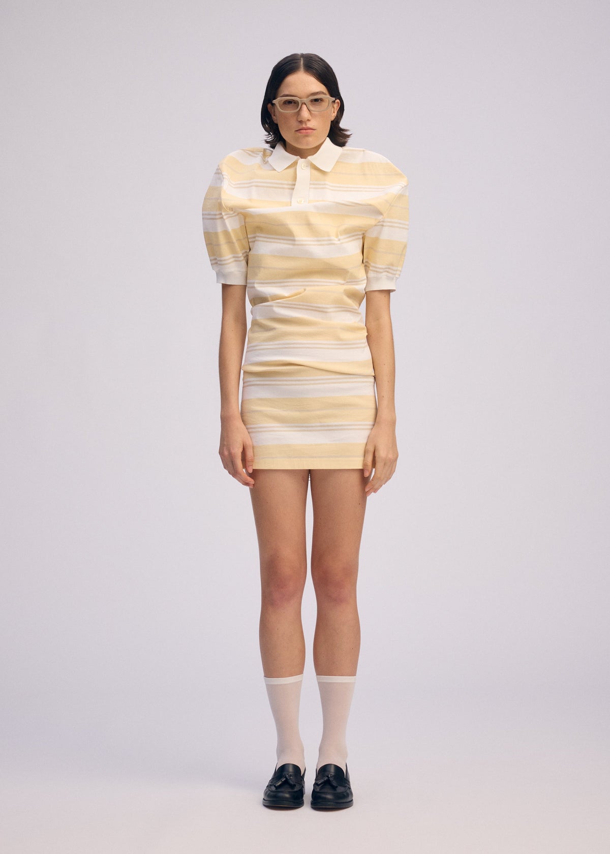 A model wears the ISSEY MIYAKE GENERIC WEAR STRIPES shirt.
