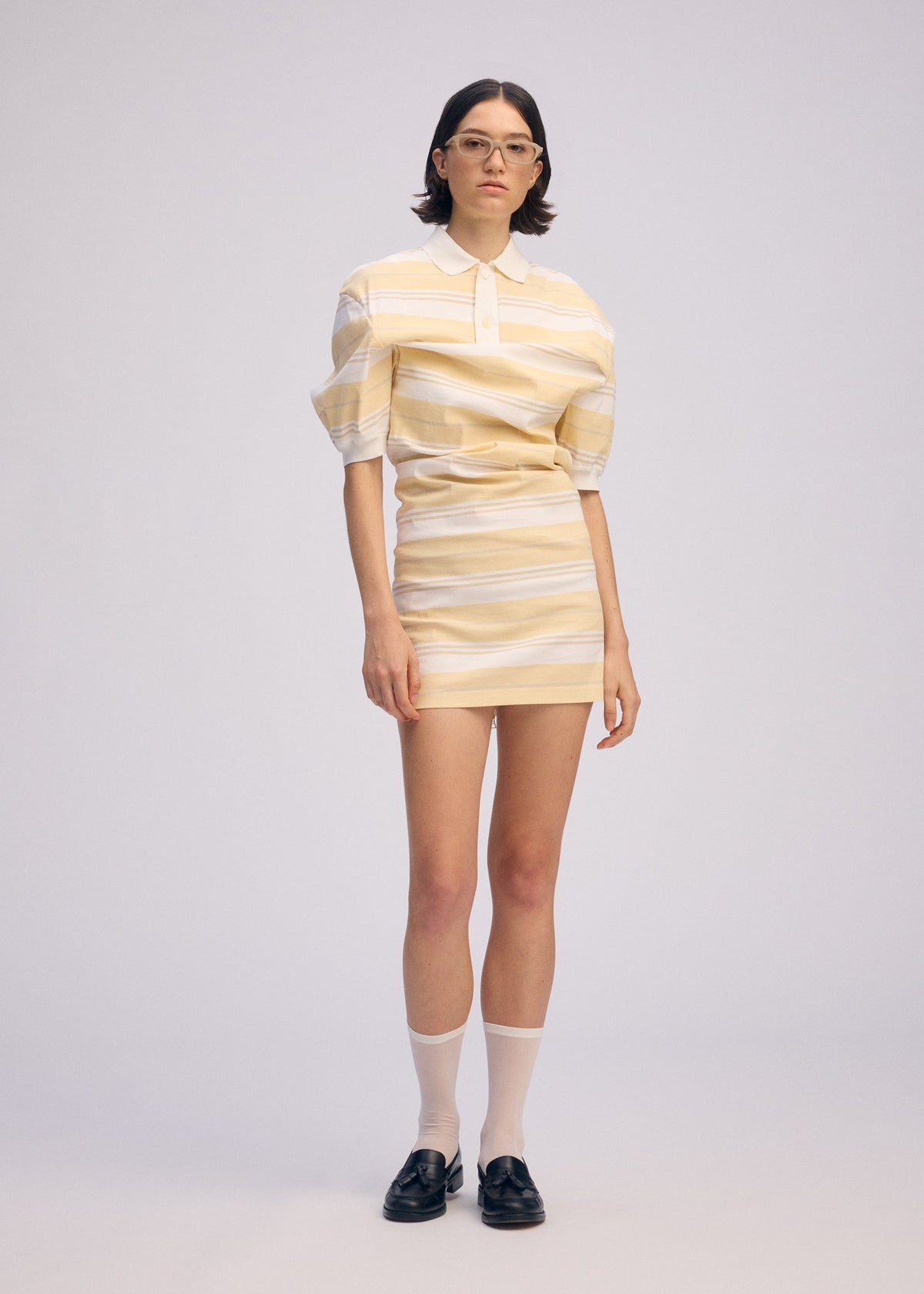A model wears the ISSEY MIYAKE GENERIC WEAR STRIPES shirt.
