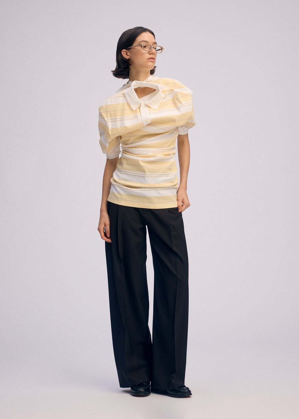 A model wears the ISSEY MIYAKE GENERIC WEAR STRIPES shirt.