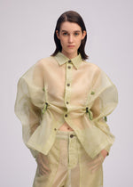 A model wears the ISSEY MIYAKE DRAW TO FORM shirt.