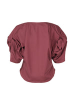 A detail shot of the ISSEY MIYAKE TWISTED DRAPE top.