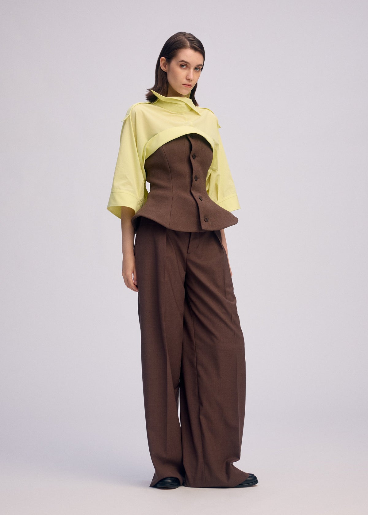 A model wears the ISSEY MIYAKE ODD SHIRT 2 shirt.