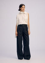 A model wears the ISSEY MIYAKE ODD SHIRT 2 shirt.