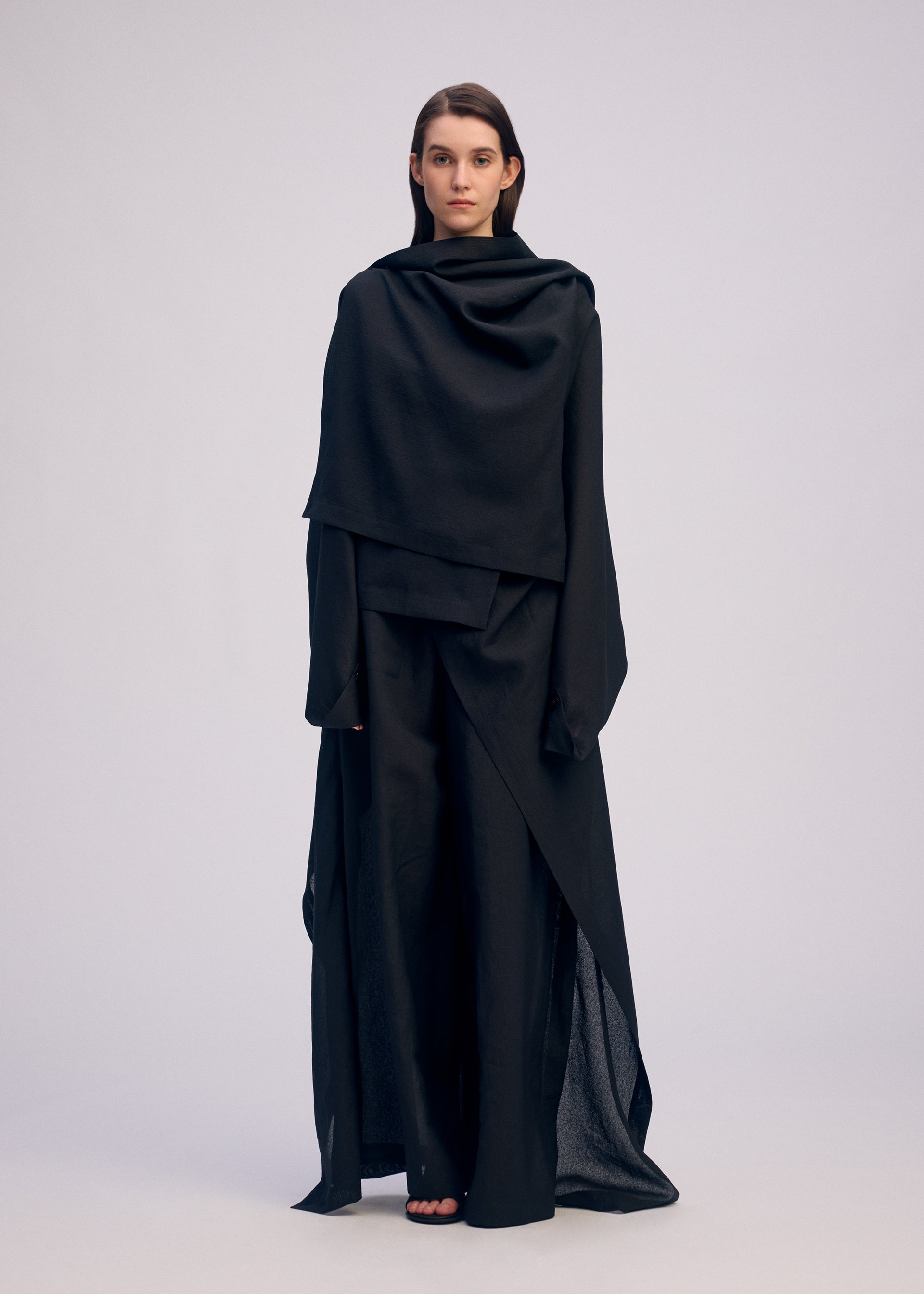 A model wears the ISSEY MIYAKE ALL SQUARES top.