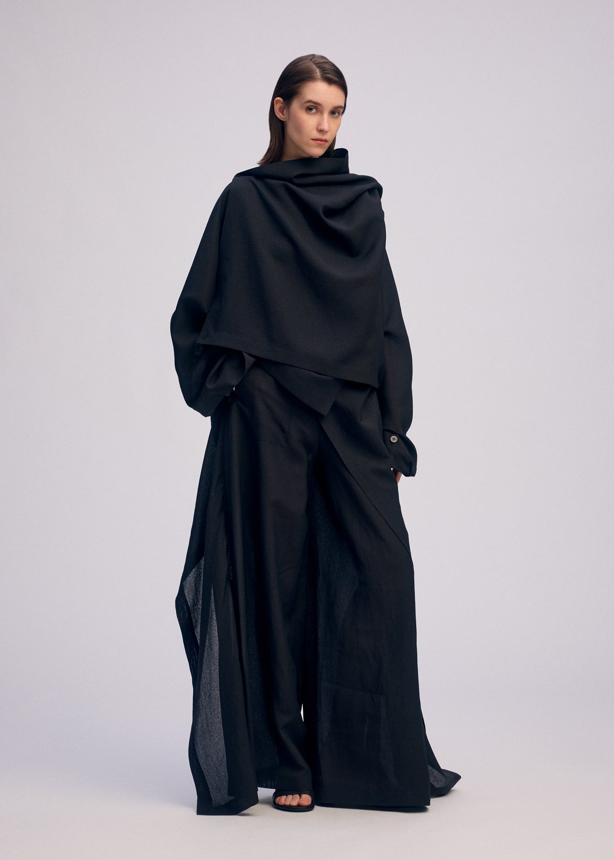 A model wears the ISSEY MIYAKE ALL SQUARES top.