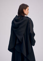 A model wears the ISSEY MIYAKE ALL SQUARES top.