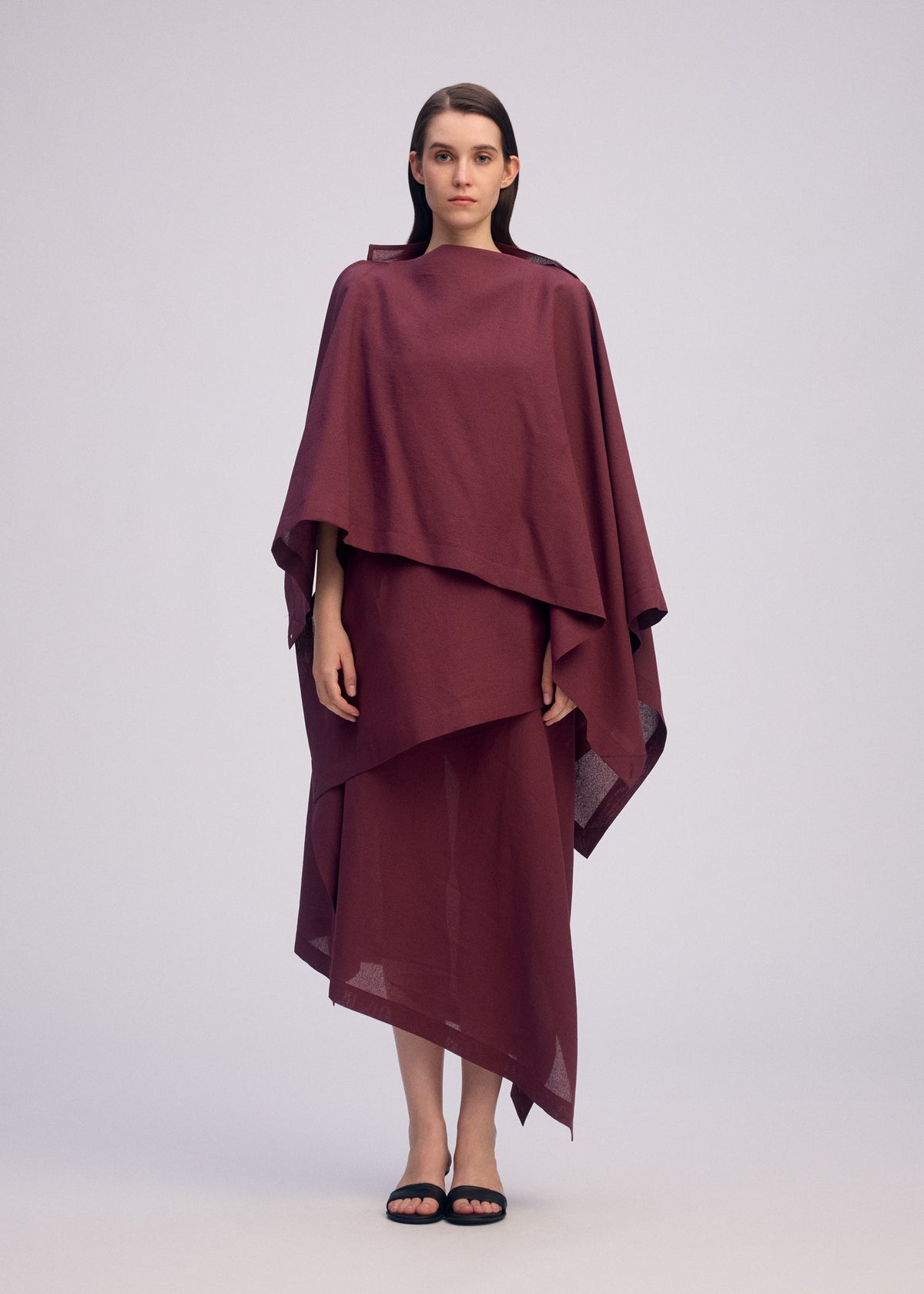 A model wears the ISSEY MIYAKE ALL SQUARES top.