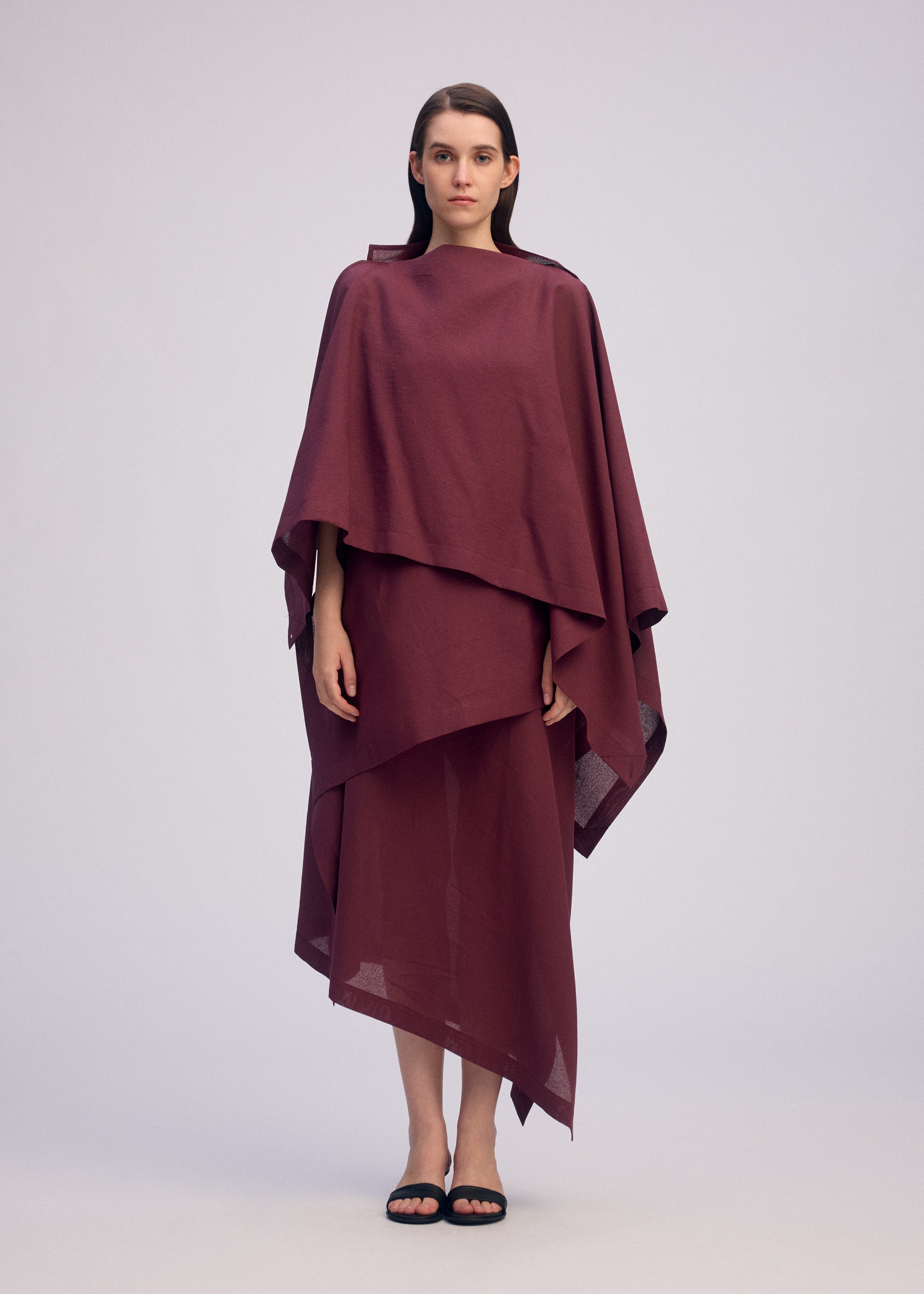 A model wears the ISSEY MIYAKE ALL SQUARES top.
