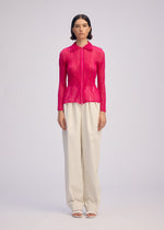 A model wears the ISSEY MIYAKE CHIFFON TWIST 1 clothing.
