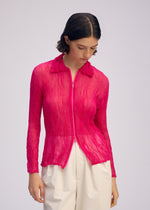 A model wears the ISSEY MIYAKE CHIFFON TWIST 1 clothing.