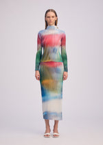 A model wears the ISSEY MIYAKE OBSCURE PLEATS clothing.