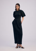 A model wears the ISSEY MIYAKE LINEN LIKE RIB PLEATS shirt.