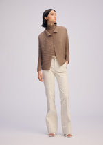 A model wears the ISSEY MIYAKE WOOLY PLEATS 66 clothing.